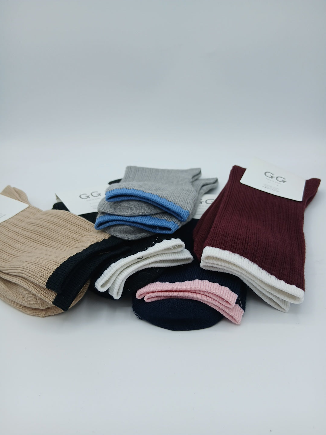 Beige and burgundy colored rim mid calf socks